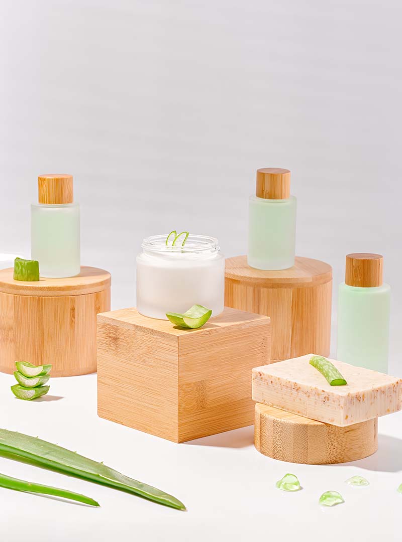 Crème et lotions pour le corps à l'aloe vera sur socles en bois